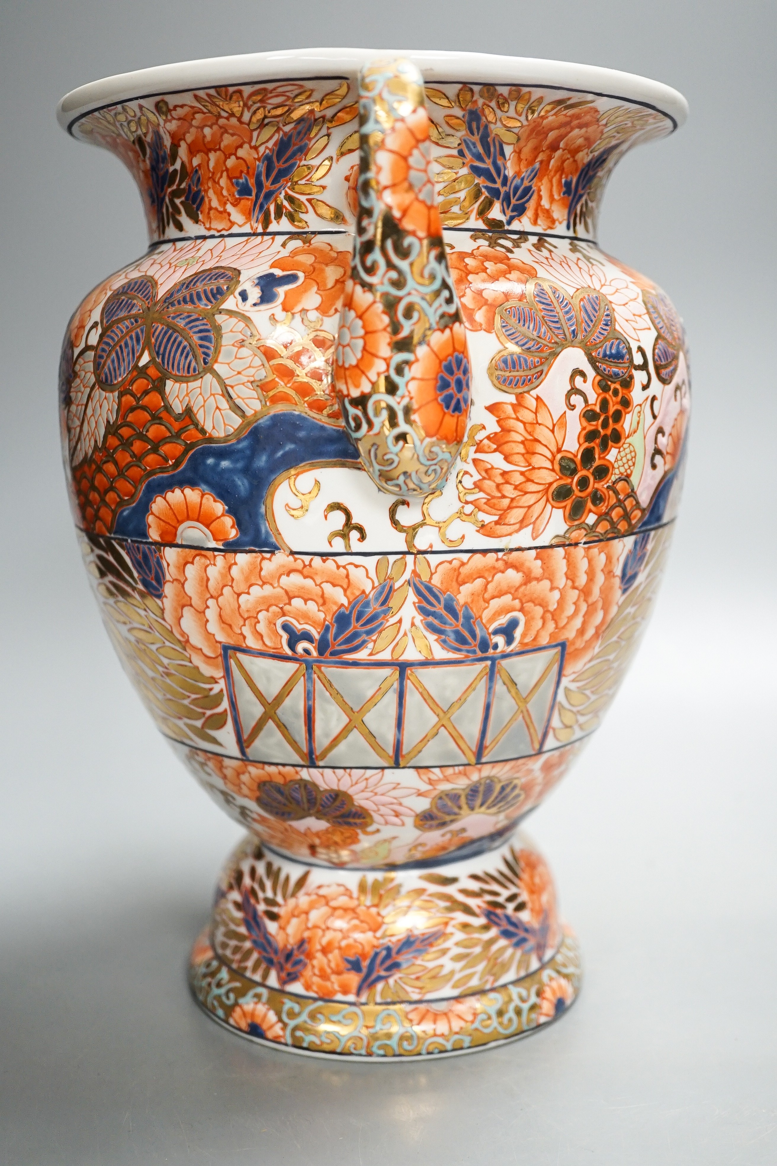 A twin handled Imari palette vase, a Japanese eggshell porcelain footed bowl, together with an 18th century Chinese porcelain bowl and saucer (with damage) 25cm (4)